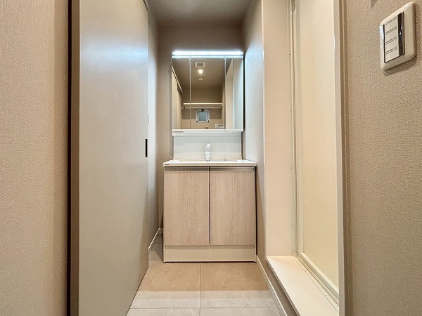 新大塚共同住宅_清潔感のあるパウダールームの写真