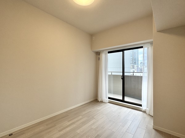 三田シティハウス_寝室の写真