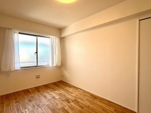 東急ドエルプレステージ浜田山ガーデンズ_約6.9帖の温かみのある洋室の写真