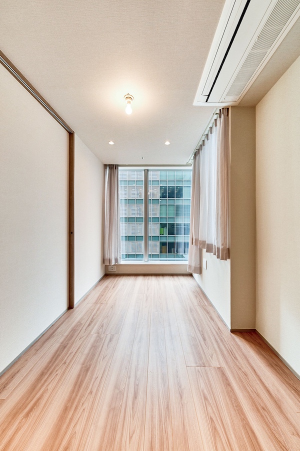 東京タイムズタワー_明るい洋室の写真